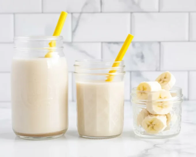 Creamy banana smoothie with milk, perfect for a healthy snack or breakfast.