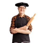 Chef Serge holding a rolling pin
