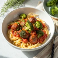 Bowl of pasta with meatballs and broccoli in tomato sauce – easy dinner recipe
