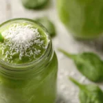Tall frothy Matcha Green Tea Smoothie with light condensation.