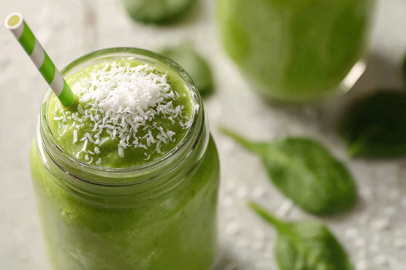 Tall frothy Matcha Green Tea Smoothie with light condensation.