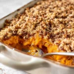 Sweet Potato Casserole with pecan topping in a baking dish
