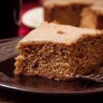 Delicious slice of Apple Butter Cake topped with apples and cinnamon