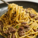 Garlic Butter Beef Pasta dish garnished with herbs and seasoning