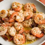 Delicious shrimp scampi served with pasta and garnished with parsley