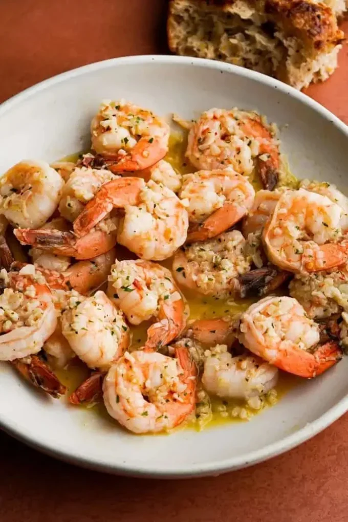 Delicious shrimp scampi served with pasta and garnished with parsley