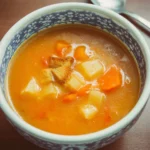 Bowl of homemade vegetable soup with fresh ingredients