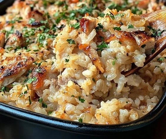 Delicious Chicken Rice Casserole served in a baking dish, garnished with herbs.