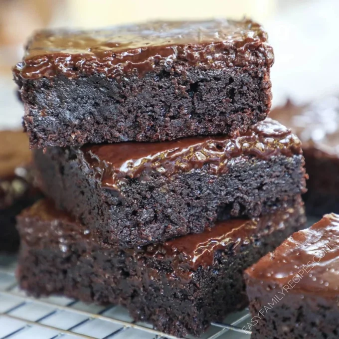 Deliciously rich fudge brownies with a glossy top and fudgy texture.