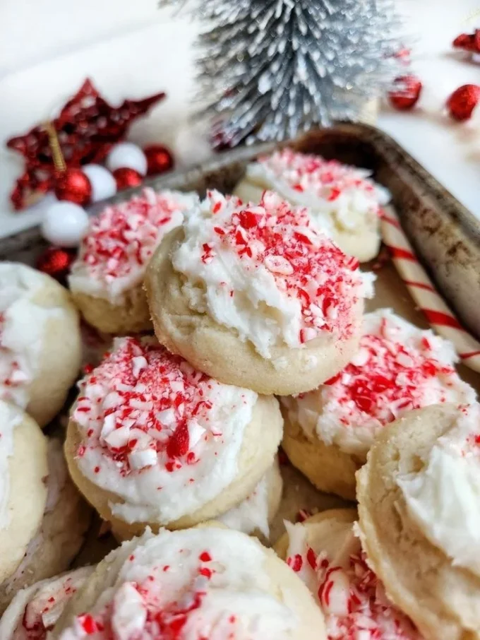 Freshly baked Peppermint Meltaway Cookies on a decorative plate.