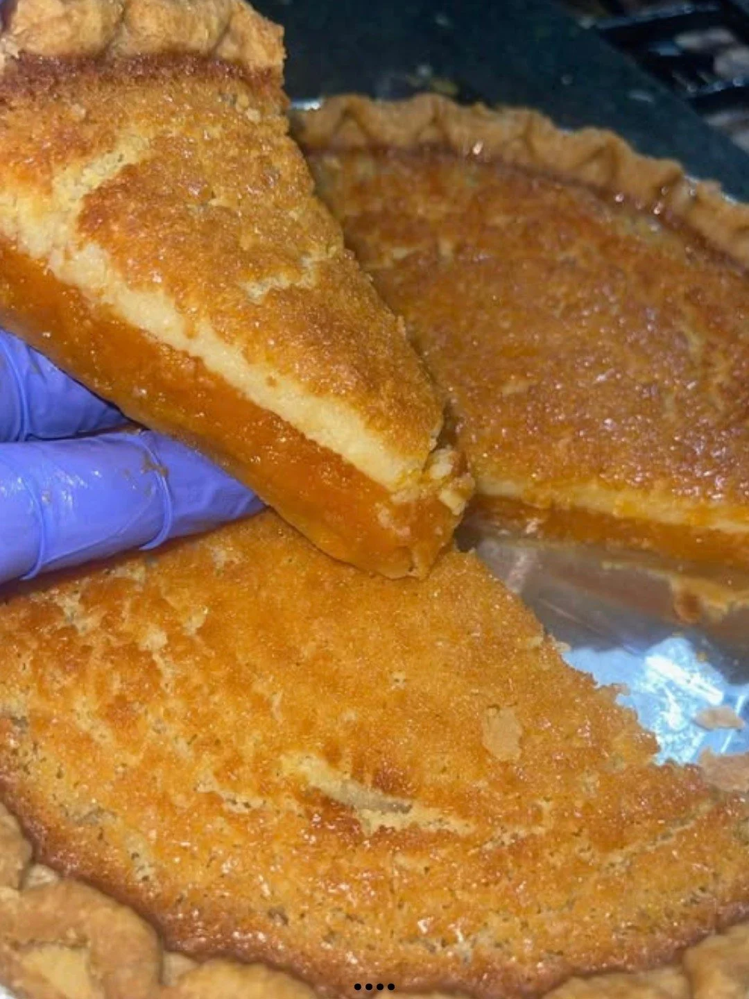 Sweet Potato Buttermilk Pie topped with whipped cream and cinnamon