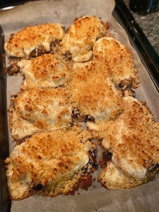 Baked chicken with Parmesan and mayonnaise, golden and crispy on a plate