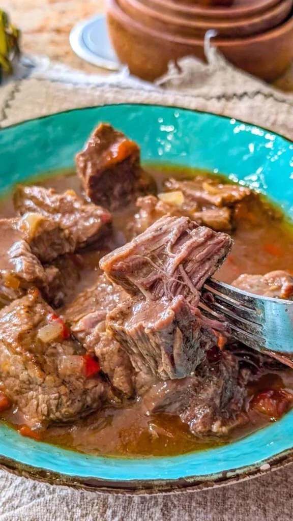 Delicious crockpot pepper steak served with green peppers and rice.