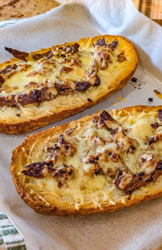 French Garlic Philly Cheesesteak Bread topped with savory ingredients