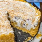 Delicious Pina Colada Pie topped with coconut and pineapple slices