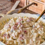 Delicious bowl of the best macaroni salad with fresh vegetables