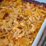 Delicious Walking Taco Bake served in a colorful dish with toppings
